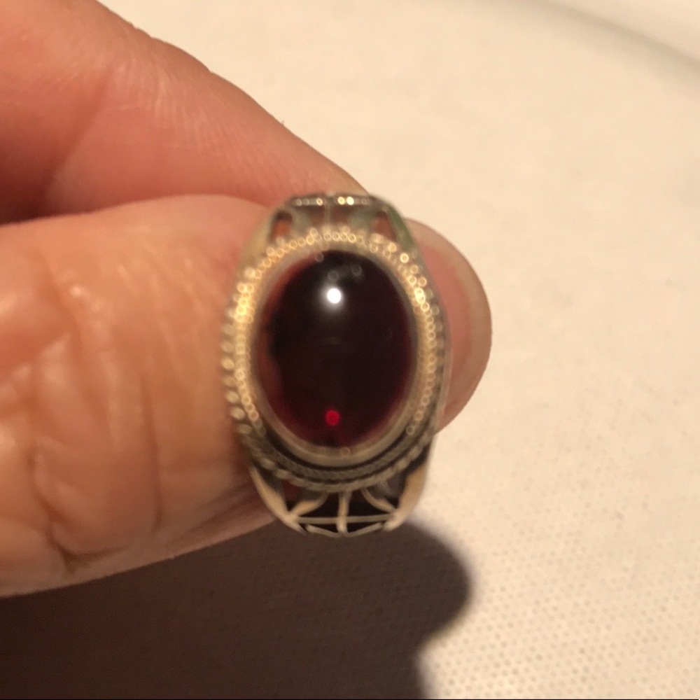 Sterling silver ring with red stone.